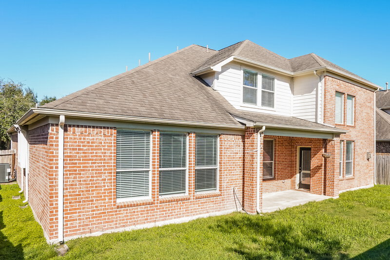 3,025/Mo, 20619 Garden Ridge Cyn Richmond, TX 77407 Rear View