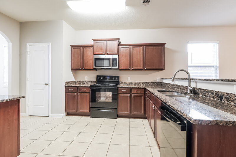 1,995/Mo, 12019 Fairquarter Ln Pinehurst, TX 77362 Kitchen View 2