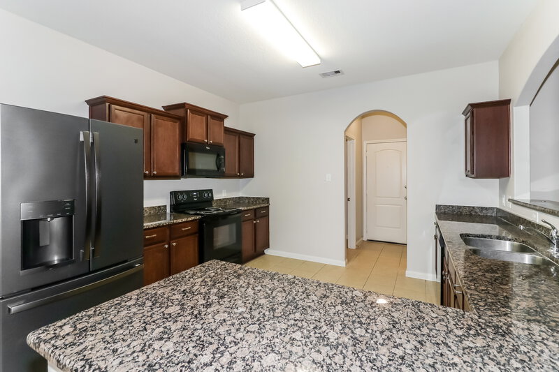 1,995/Mo, 12074 Fairquarter Ln Pinehurst, TX 77362 Kitchen View