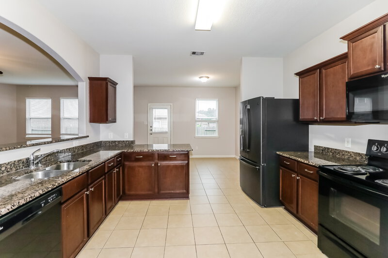 1,995/Mo, 12074 Fairquarter Ln Pinehurst, TX 77362 Kitchen View 2