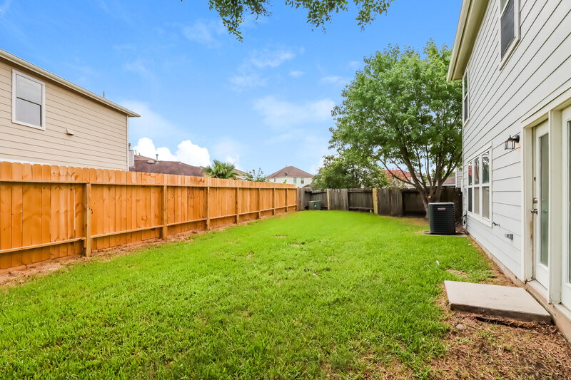 2,145/Mo, 6806 Oleander Grove Way Houston, TX 77049 Backyard View