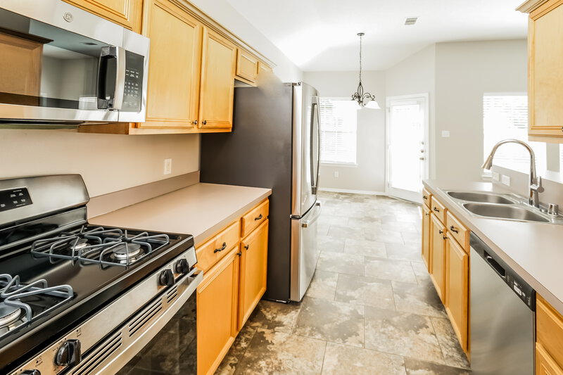 1,880/Mo, 11927 Belle Ct Pinehurst, TX 77362 Kitchen View 2