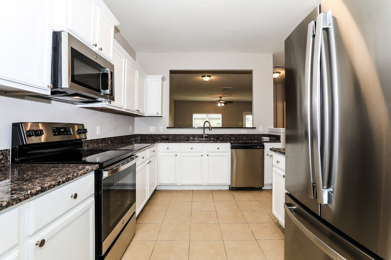 2,510/Mo, 12027 Fairquarter Ln Pinehurst, TX 77362 Kitchen View 2