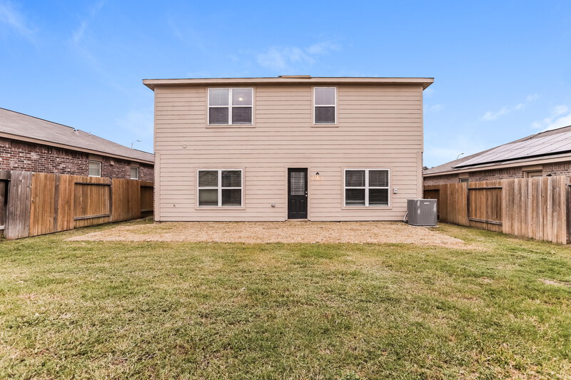 2,510/Mo, 12027 Fairquarter Ln Pinehurst, TX 77362 Rear View