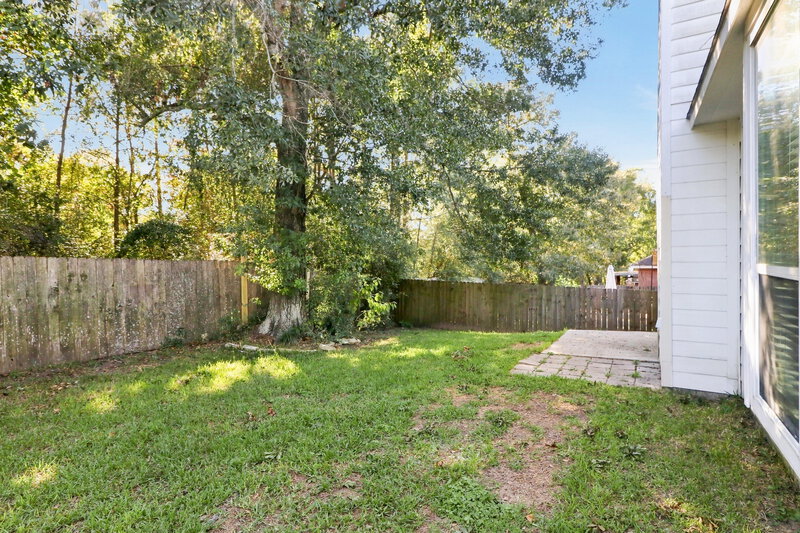 1,875/Mo, 2309 Highland Crossing Dr Conroe, TX 77304 Backyard View