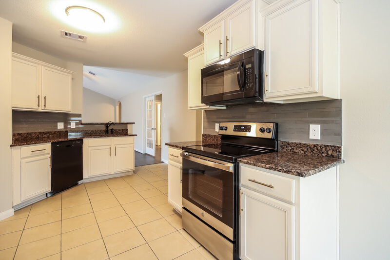 2,085/Mo, 12039 Fairquarter Ln Pinehurst, TX 77362 Kitchen View
