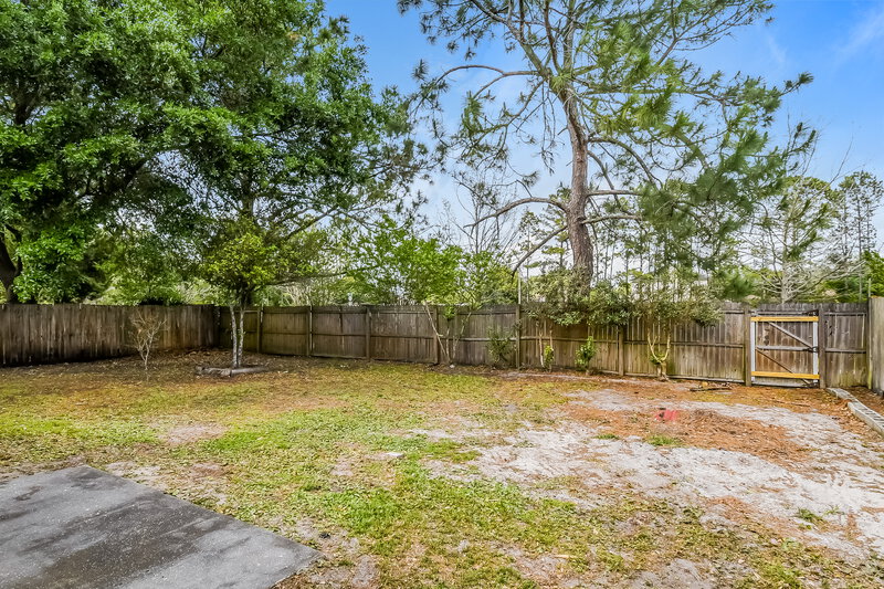 1,750/Mo, 8785 Spring Harvest Ln E Jacksonville, FL 32244 Rear View 2