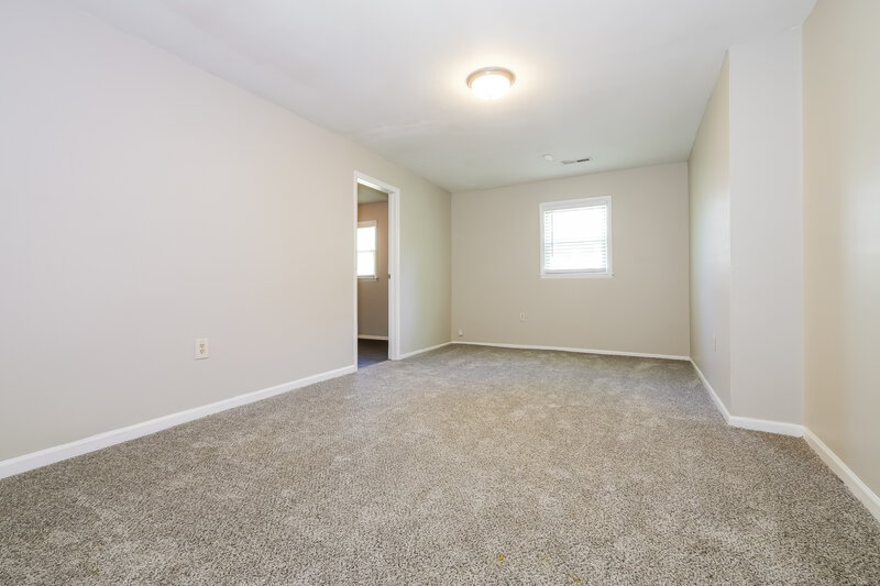 1,565/Mo, 410 S Washington St Raymore, MO 64083 Main Bedroom View 2