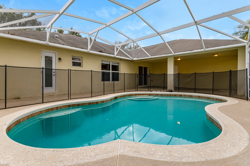 2,500/Mo, 3321 White Blossom Ln Clermont, FL 34711 Rear View 2