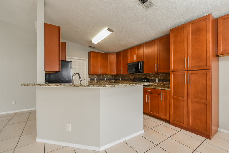 2,035/Mo, 8669 Wellington Loop Kissimmee, FL 34747 Kitchen View 2