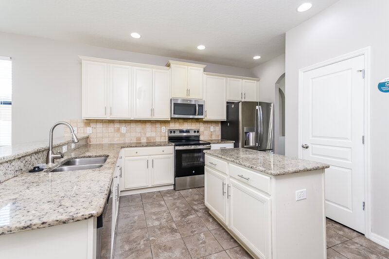 2,030/Mo, 3937 Blossom Dew Dr Kissimmee, FL 34746 Kitchen View 2