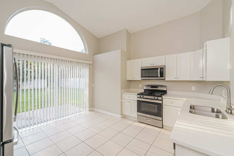 2,365/Mo, 6859 Bouganvillea Crescent Dr Orlando, FL 32809 Kitchen View