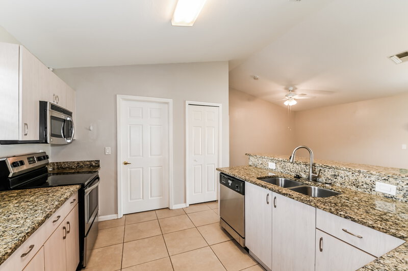 1,950/Mo, 607 Bell Blvd S Lehigh Acres, FL 33974 Kitchen View 3