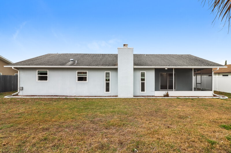 2,150/Mo, 12909 Walnut Tree Ln Hudson, FL 34669 Rear View