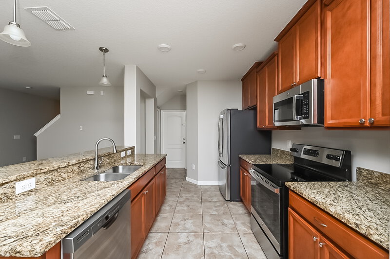 1,950/Mo, 10041 Newminster Loop Ruskin, FL 33573 Kitchen View 2