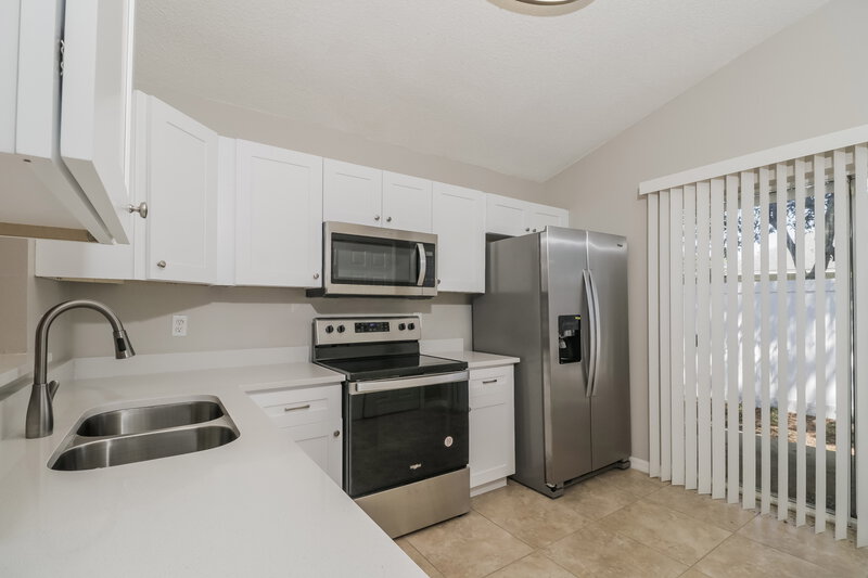 1,860/Mo, 28709 Seashell Ct Wesley Chapel, FL 33545 Kitchen View 2